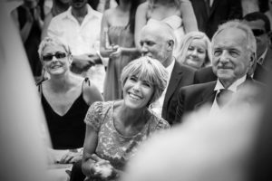 Wayne and Penny Judd looking on and laughing at the wedding ceremony of Alfie Skilleter and Elaina in Hyde Park